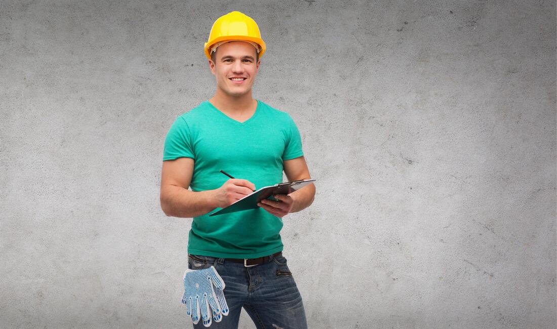 a worker holding a check list